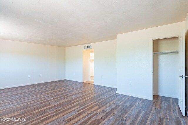 912 S Las Lomas Cir, Green Valley, AZ 85614 - interior space with baseboards, visible vents, a closet, and dark wood-type flooring