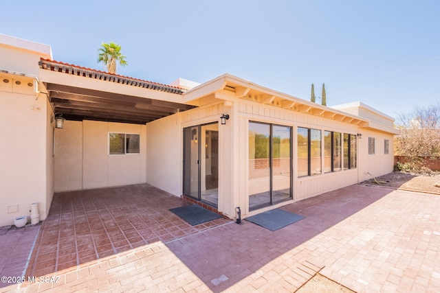 912 S Las Lomas Cir, Green Valley, AZ 85614 - rear view of house featuring stucco siding and a patio