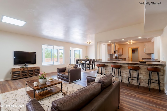 912 S Las Lomas Cir, Green Valley, AZ 85614 - living room featuring wood finished floors, recessed lighting, and baseboards
