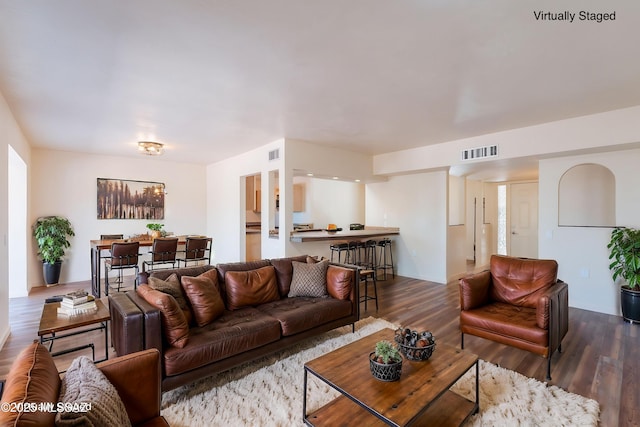 912 S Las Lomas Cir, Green Valley, AZ 85614 - living area featuring visible vents and dark wood-style floors