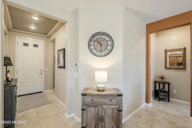 interior space featuring baseboards and light tile patterned floors
