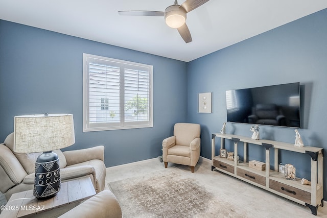 interior space featuring a ceiling fan and baseboards
