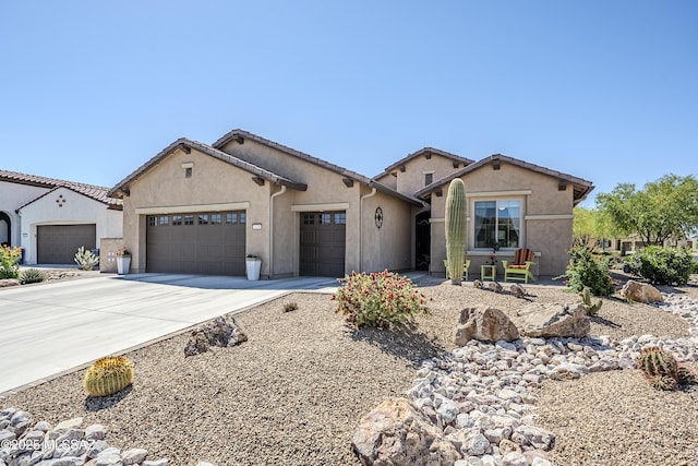 ranch-style house with stucco siding, concrete driveway, and a garage