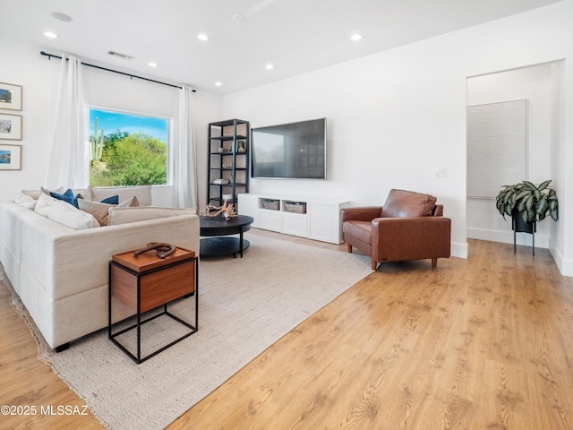 2540 W Oasis Springs Ct, Tucson, AZ 85742 - living room with recessed lighting, visible vents, and light wood-style flooring
