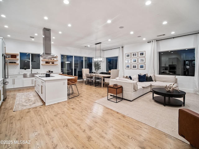 2540 W Oasis Springs Ct, Tucson, AZ 85742 - living area featuring recessed lighting, visible vents, and light wood-type flooring