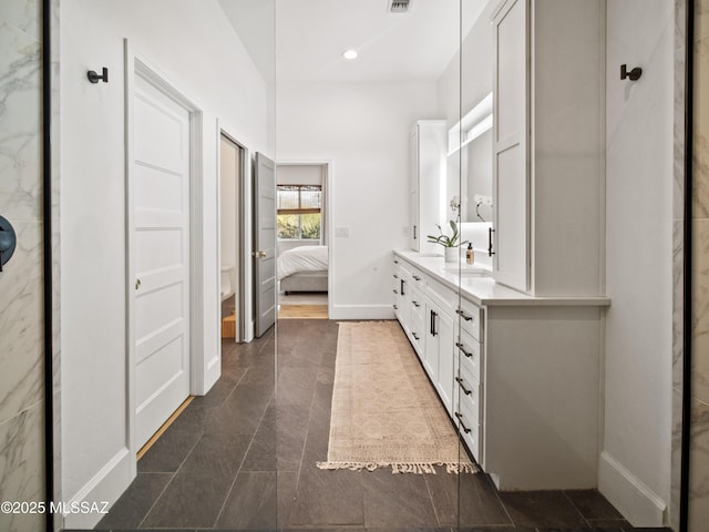2540 W Oasis Springs Ct, Tucson, AZ 85742 - bathroom featuring visible vents, double vanity, baseboards, ensuite bathroom, and recessed lighting