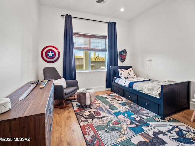 2540 W Oasis Springs Ct, Tucson, AZ 85742 - bedroom with baseboards, wood finished floors, and visible vents