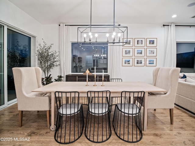 2540 W Oasis Springs Ct, Tucson, AZ 85742 - dining area with visible vents, wood finished floors, and a chandelier