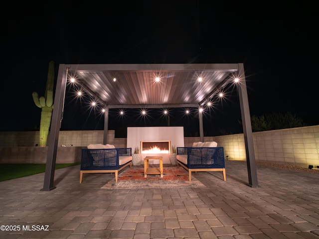 2540 W Oasis Springs Ct, Tucson, AZ 85742 - patio at twilight with a fenced backyard and outdoor lounge area