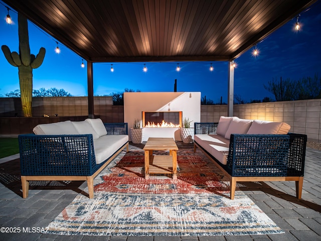 2540 W Oasis Springs Ct, Tucson, AZ 85742 - view of patio featuring a fenced backyard and an outdoor living space with a fireplace