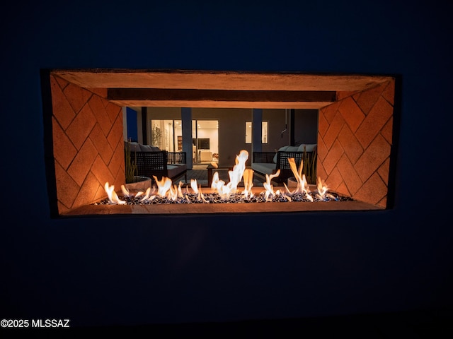 2540 W Oasis Springs Ct, Tucson, AZ 85742 - back of house at night featuring a fire pit