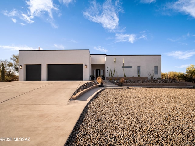 2540 W Oasis Springs Ct, Tucson, AZ 85742 - contemporary house with a garage, stucco siding, and driveway