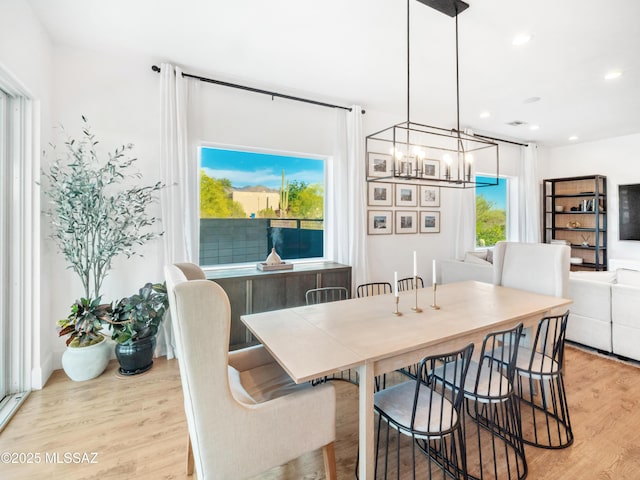 2540 W Oasis Springs Ct, Tucson, AZ 85742 - dining space with light wood-type flooring, recessed lighting, and a notable chandelier