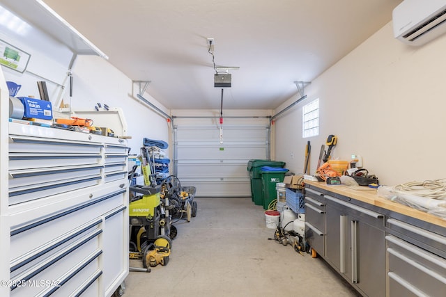 garage with a garage door opener and a wall mounted AC