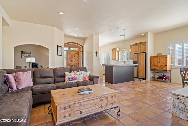 living area featuring light tile patterned flooring and recessed lighting