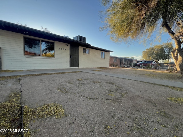 single story home featuring brick siding