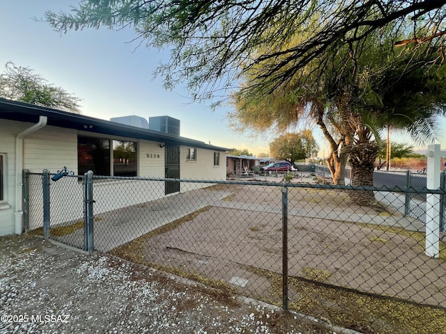 view of side of home with fence