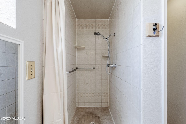 bathroom featuring a shower stall
