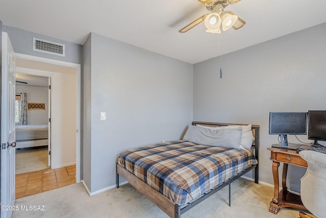 bedroom with baseboards, visible vents, ceiling fan, and light colored carpet