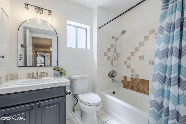 bathroom with tile patterned floors, shower / bath combo, vanity, and toilet
