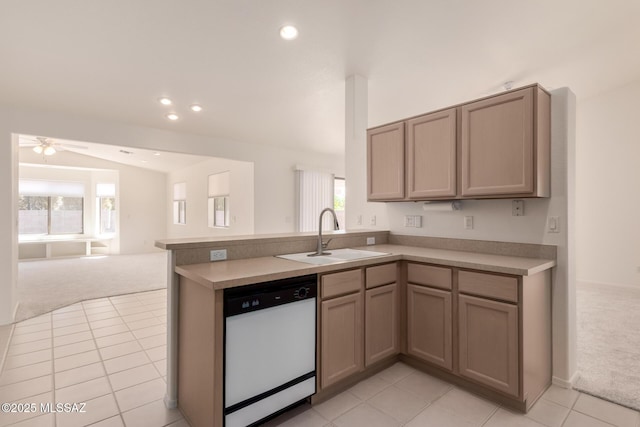 kitchen featuring light colored carpet, dishwasher, a sink, a peninsula, and open floor plan