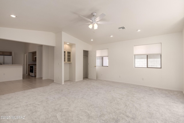 unfurnished living room with recessed lighting, a ceiling fan, visible vents, vaulted ceiling, and light colored carpet