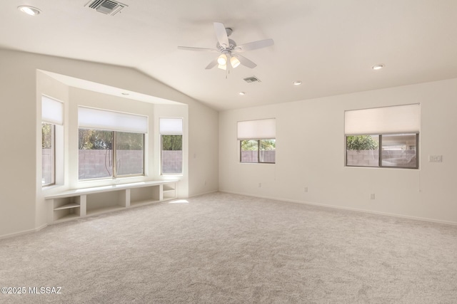 carpeted spare room featuring recessed lighting, baseboards, visible vents, a ceiling fan, and lofted ceiling