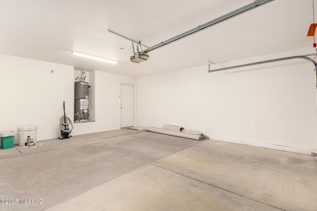 garage with a garage door opener and water heater