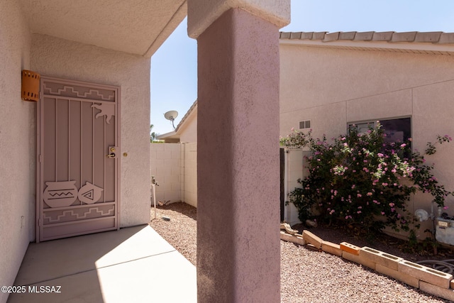 view of side of property featuring stucco siding