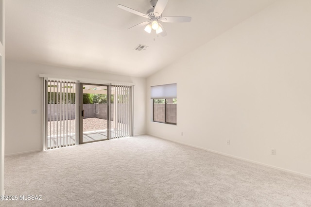 carpeted empty room featuring visible vents, ceiling fan, high vaulted ceiling, and baseboards