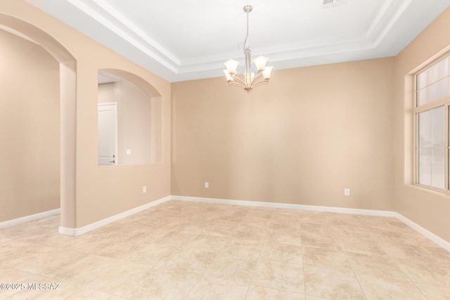 unfurnished room with visible vents, a raised ceiling, a chandelier, arched walkways, and light tile patterned floors