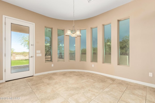 interior space with an inviting chandelier and light tile patterned floors