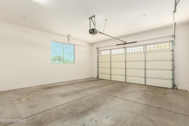 garage featuring baseboards and a garage door opener