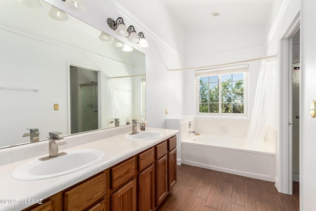 bathroom with a sink, a bathtub, wood finished floors, and a shower with shower curtain