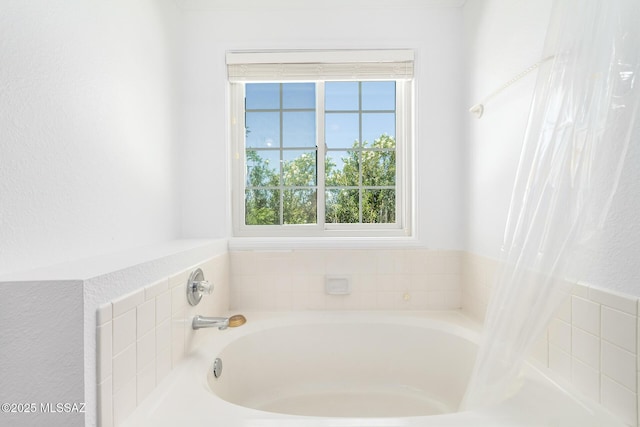 full bath with a bath and a wealth of natural light