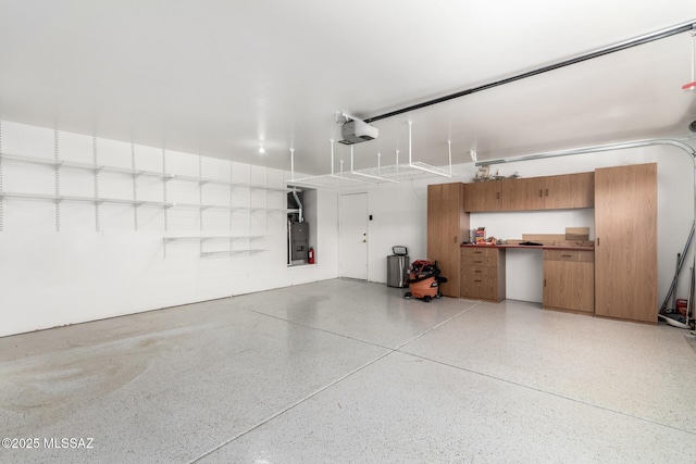 garage featuring a garage door opener and electric panel