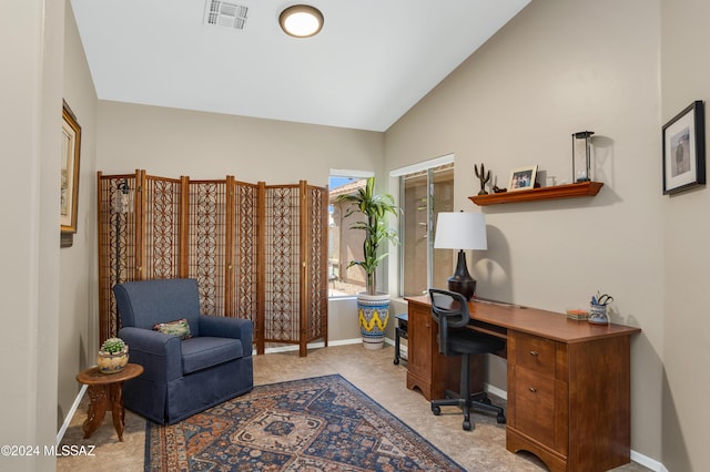 office with lofted ceiling, baseboards, visible vents, and carpet flooring