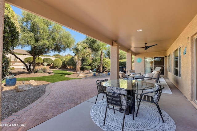 view of patio / terrace featuring outdoor dining space and a ceiling fan