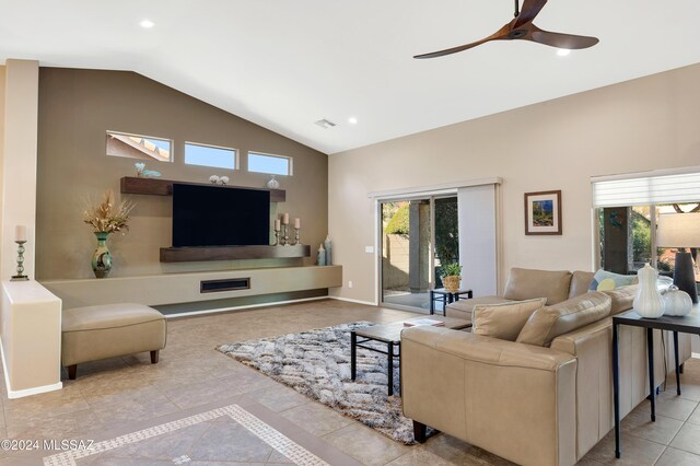 living area featuring tile patterned floors, baseboards, recessed lighting, a ceiling fan, and high vaulted ceiling