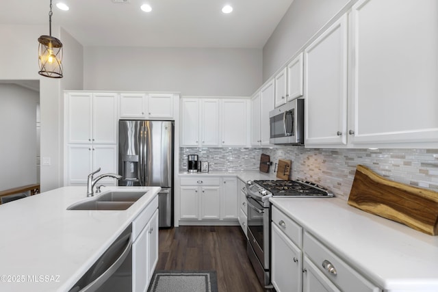 32968 S Cattle Trl, Oracle, AZ 85623 - kitchen featuring a sink, light countertops, white cabinets, and stainless steel appliances