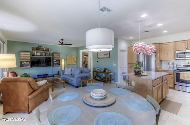 dining room with ceiling fan, visible vents, and recessed lighting