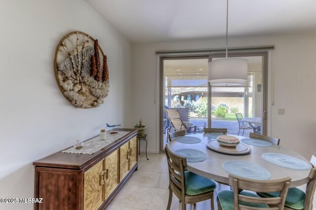 dining area featuring light tile patterned floors