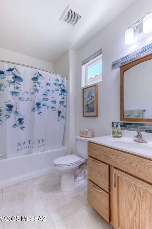full bath with tile patterned flooring, shower / bath combination with curtain, visible vents, toilet, and vanity