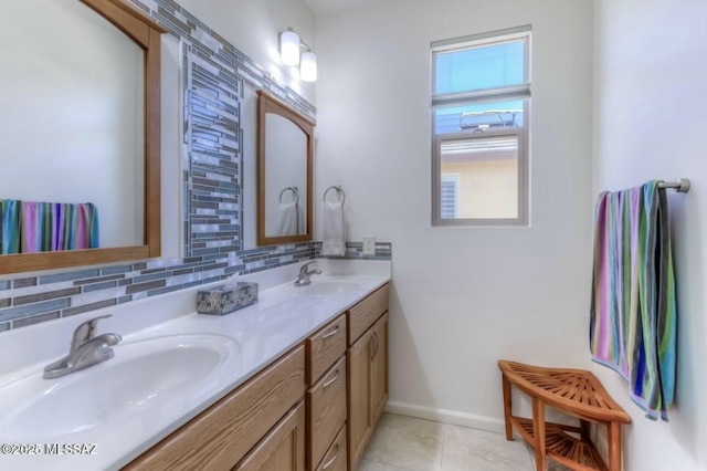 full bath with decorative backsplash, baseboards, a sink, and double vanity