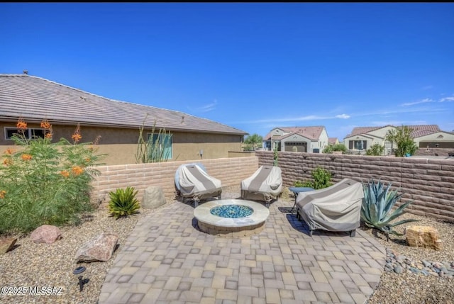view of patio / terrace featuring a fire pit, a grill, and fence