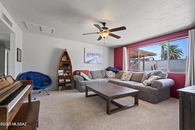 9061 E 39th St, Tucson, AZ 85730 - living room with ceiling fan, light carpet, and visible vents