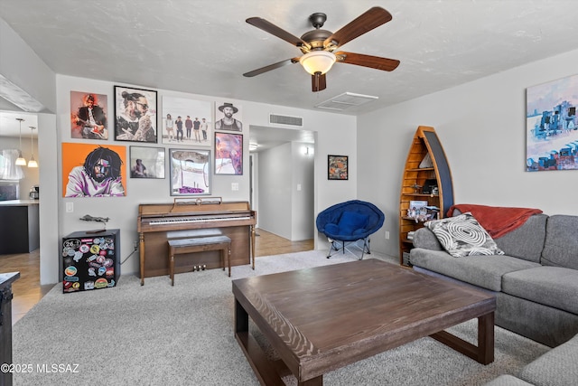 9061 E 39th St, Tucson, AZ 85730 - living room with carpet floors, ceiling fan, and visible vents