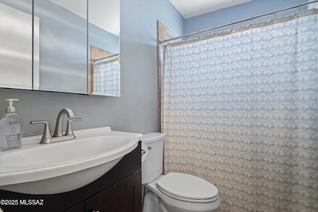9061 E 39th St, Tucson, AZ 85730 - bathroom featuring vanity, toilet, and a shower with shower curtain