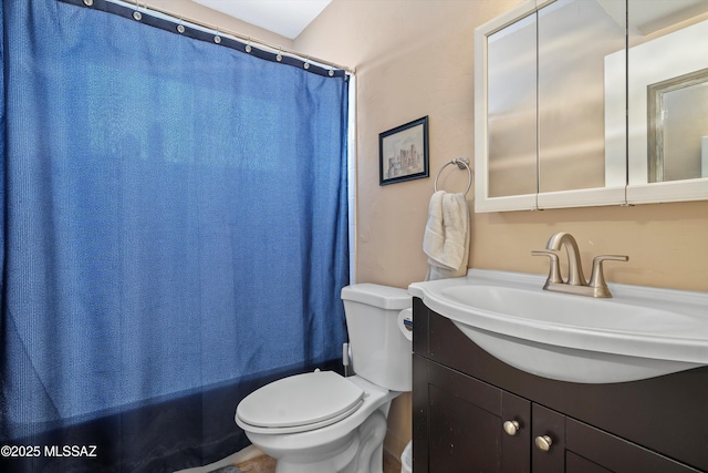 9061 E 39th St, Tucson, AZ 85730 - bathroom featuring vanity, shower / bath combo with shower curtain, and toilet