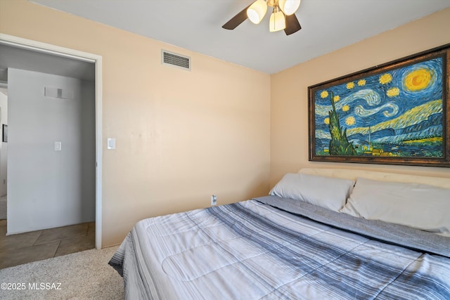 9061 E 39th St, Tucson, AZ 85730 - bedroom featuring ceiling fan and visible vents